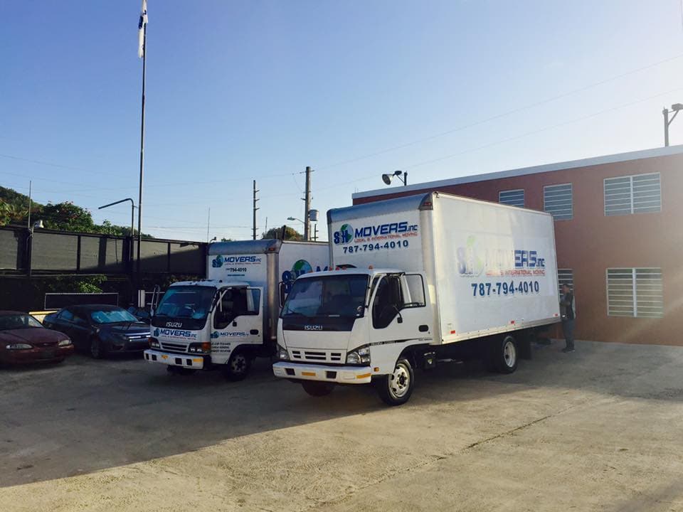 SSH Movers branded trucks outside the Dorado headquarters
