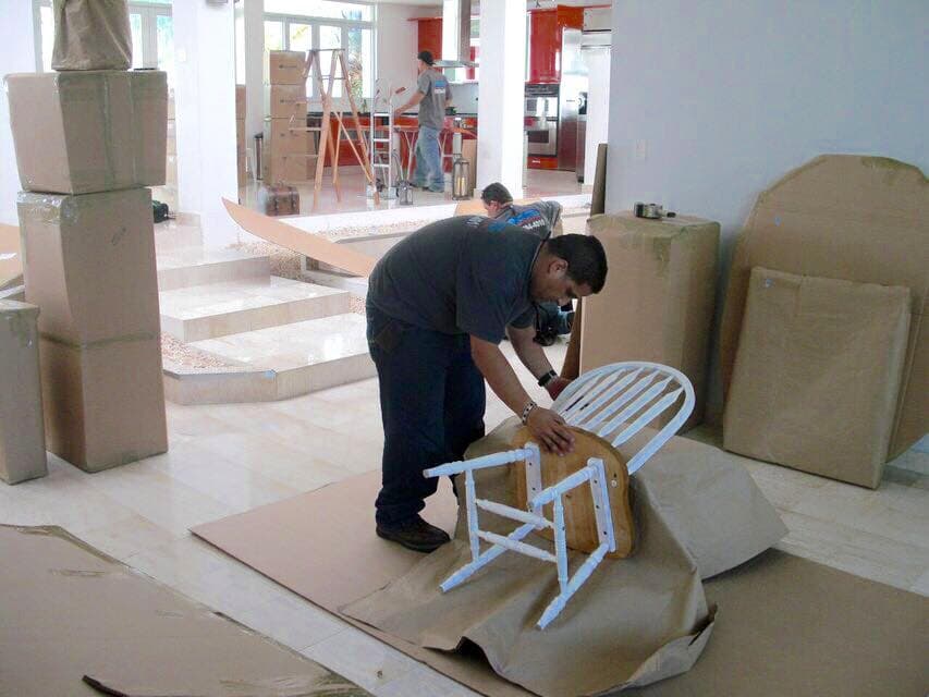 SSH Movers crew wrapping furniture piece by piece
