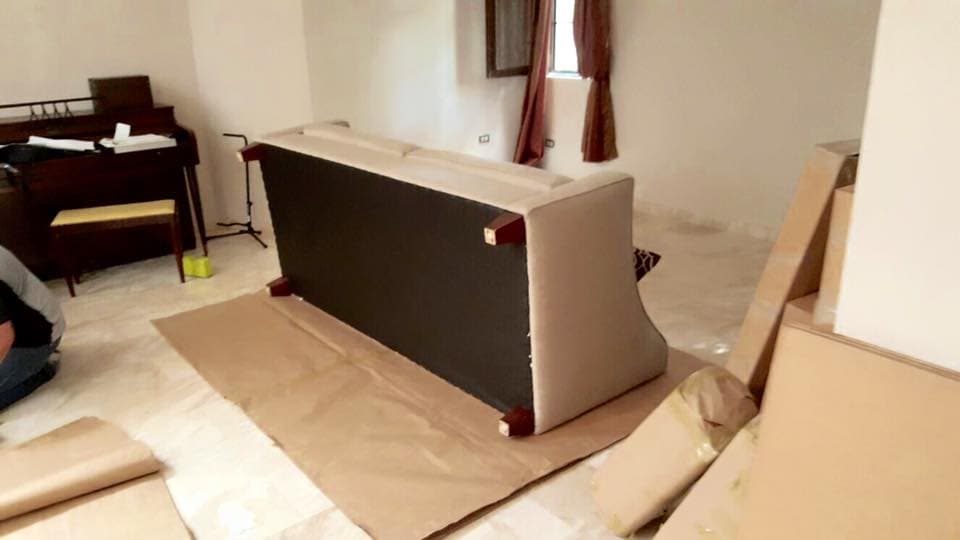 Sofa wrapped over protective paper before transport